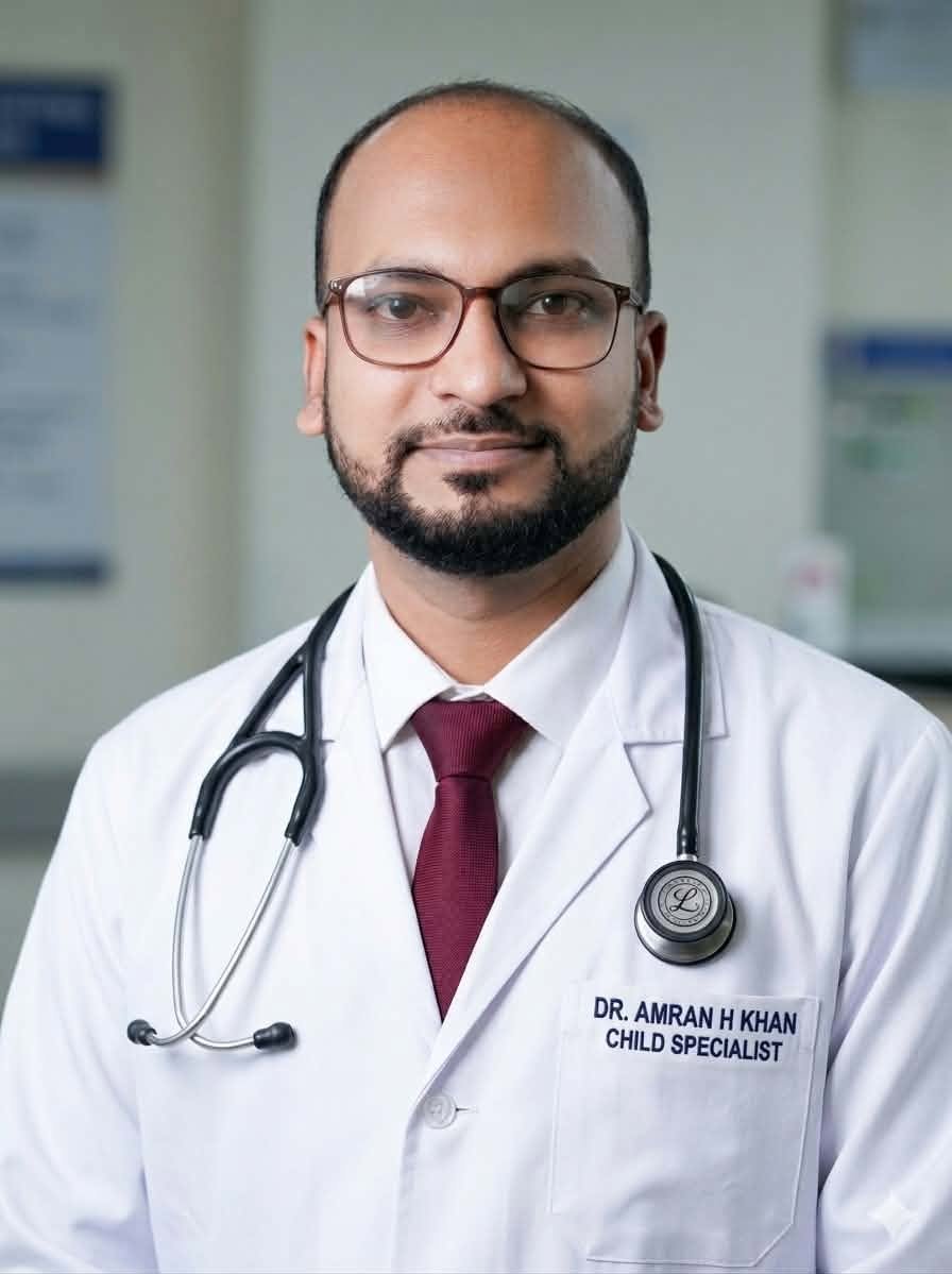 Passport-size photo of Dr. Amran H Khan